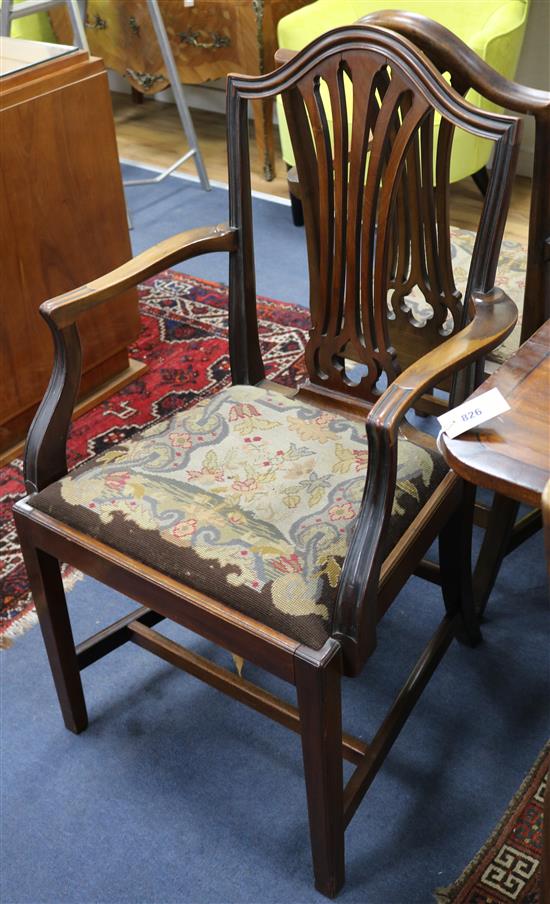 A set of six Hepplewhite style mahogany dining chairs, with drop in tapestry seats (four single, two arms)